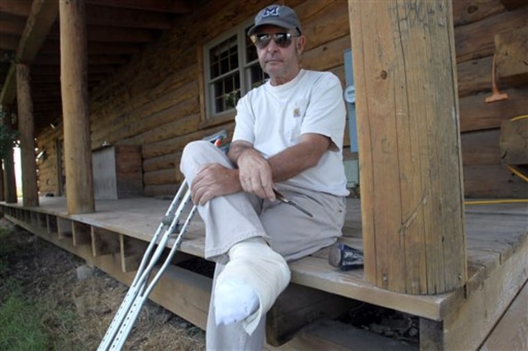 In this Tuesday, Aug. 30, 2011 photo, John Hutt holds his Old Timer pocketknife while sitting on the front porch of his home in Montrose, Colo. On Aug. 19, 2011, Hutt became pinned on his logging truck and was forced to cut off his own toes to get to safety. (AP Photo/The Grand Junction Daily Sentinel, William Woody)